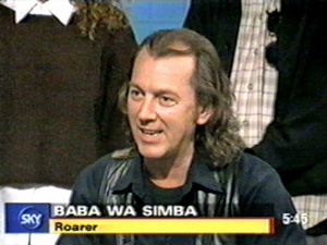 Joey Skaggs being interviewed as Baba Wa Simba on Sky TV
