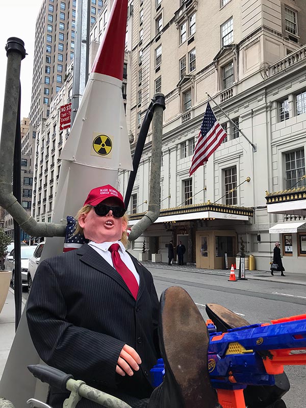 Trump reclines on his rocket getting ready for his Military Parade, April 1, 2018